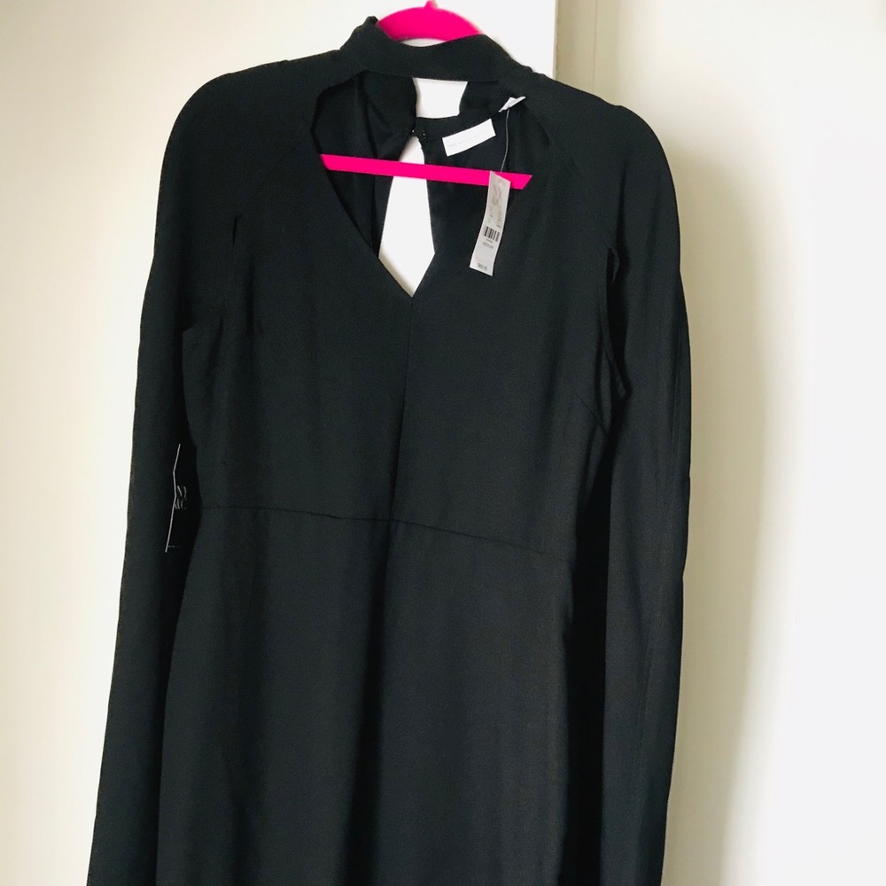 Elegant little black dress with cape detail